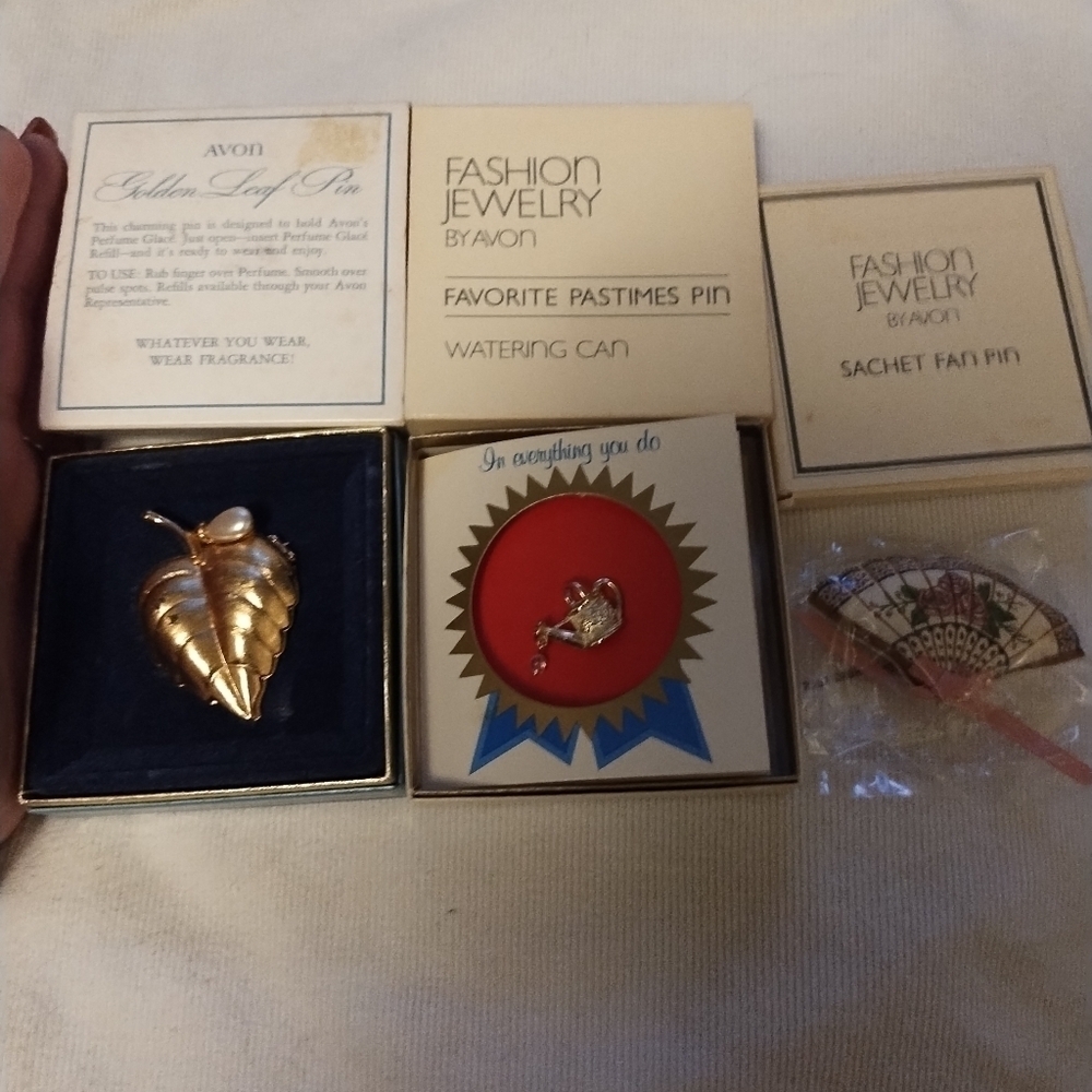 Set of 3 vintage Avon pins in boxes